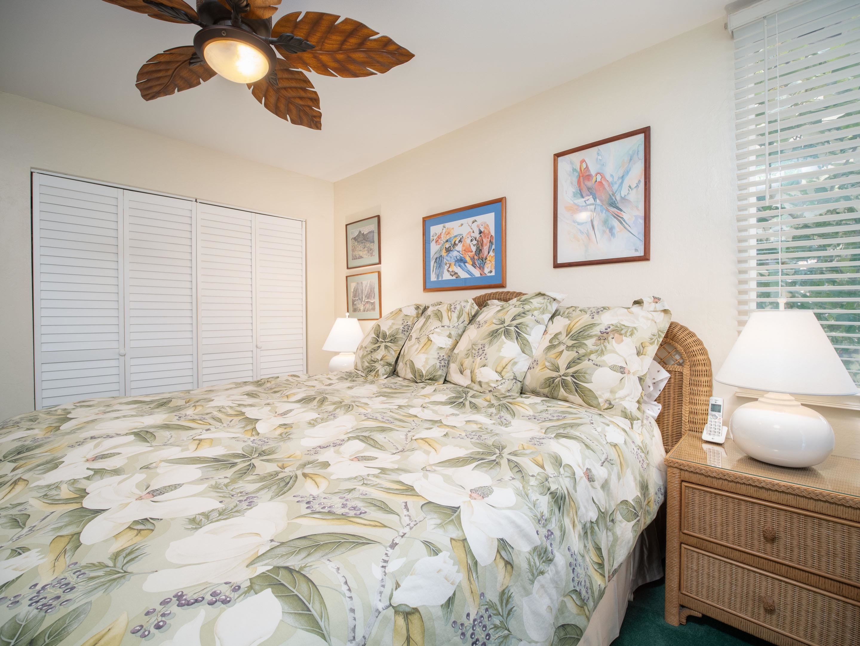 2737 South Kihei Road, Unit 1119 Kihei, HI 96753 - Photo 6 of 24 a bed room with a bed and a painting on the wall