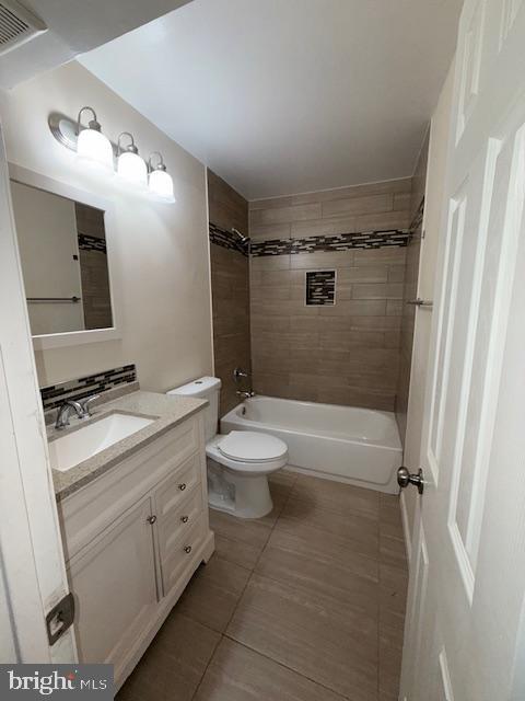 2 Normandy Square Court, Unit D Silver Spring, MD 20906 - Photo 18 of 32 a bathroom with a granite countertop sink toilet a mirror and shower