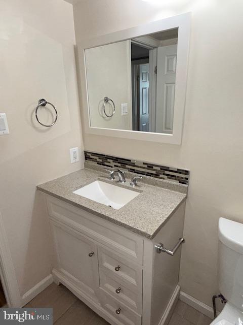 2 Normandy Square Court, Unit D Silver Spring, MD 20906 - Photo 19 of 32 a bathroom with a granite countertop sink and a mirror