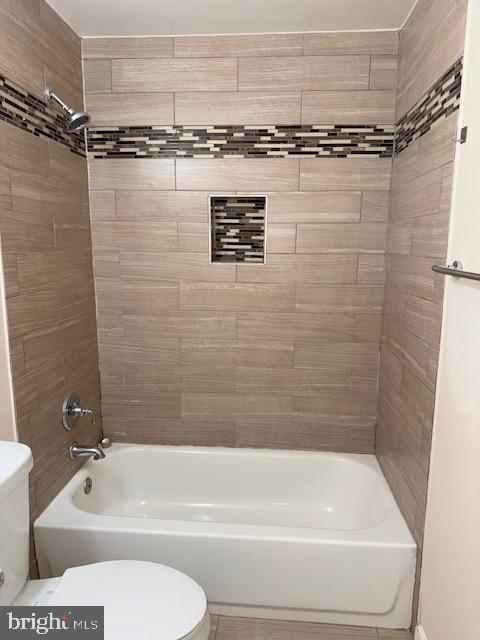 2 Normandy Square Court, Unit D Silver Spring, MD 20906 - Photo 20 of 32 a bathroom with a shower a toilet and a bathtub