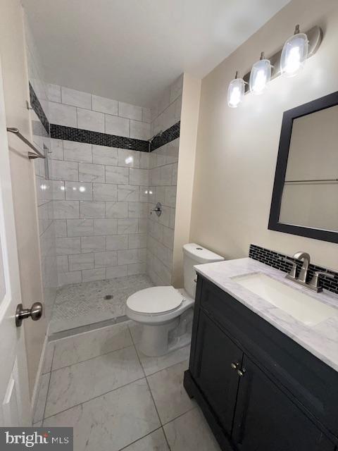 2 Normandy Square Court, Unit D Silver Spring, MD 20906 - Photo 21 of 32 a bathroom with a double vanity sink toilet and shower