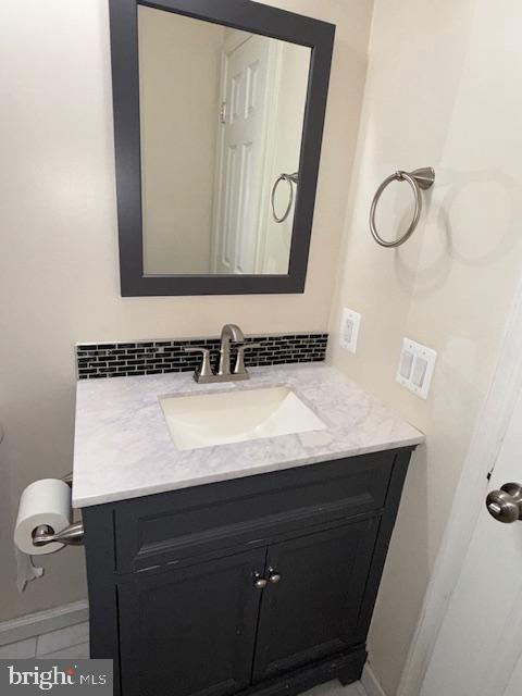 2 Normandy Square Court, Unit D Silver Spring, MD 20906 - Photo 22 of 32 a bathroom with a sink and a mirror