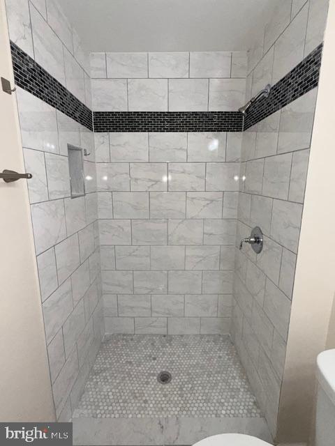 2 Normandy Square Court, Unit D Silver Spring, MD 20906 - Photo 23 of 32 a bathroom with a shower