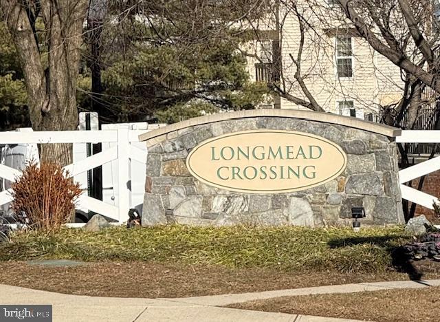 2 Normandy Square Court, Unit D Silver Spring, MD 20906 - Photo 26 of 32 a view of a building with a sign board