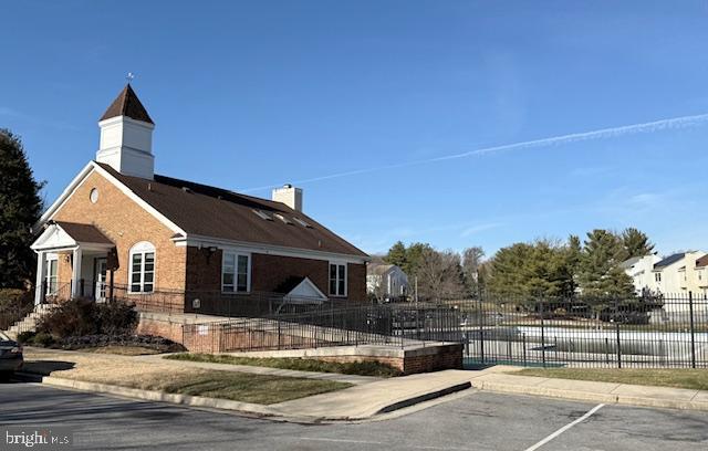 2 Normandy Square Court, Unit D Silver Spring, MD 20906 - Photo 27 of 32 a front view of a house with a porch