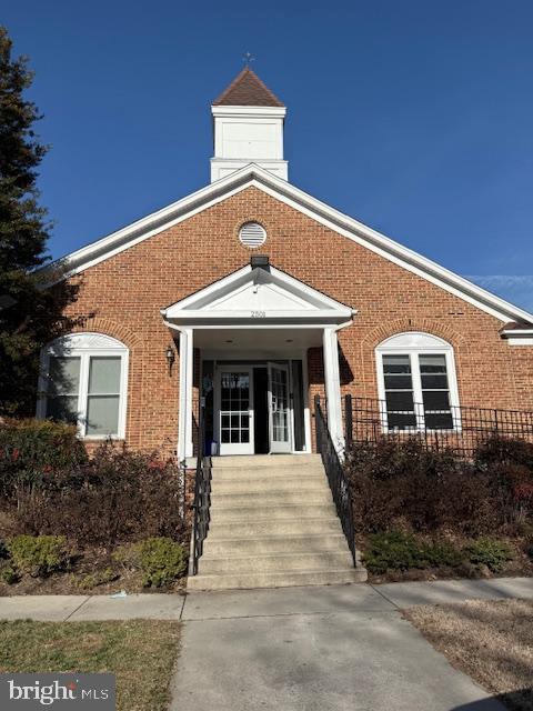 2 Normandy Square Court, Unit D Silver Spring, MD 20906 - Photo 28 of 32 a front view of a house with a garden