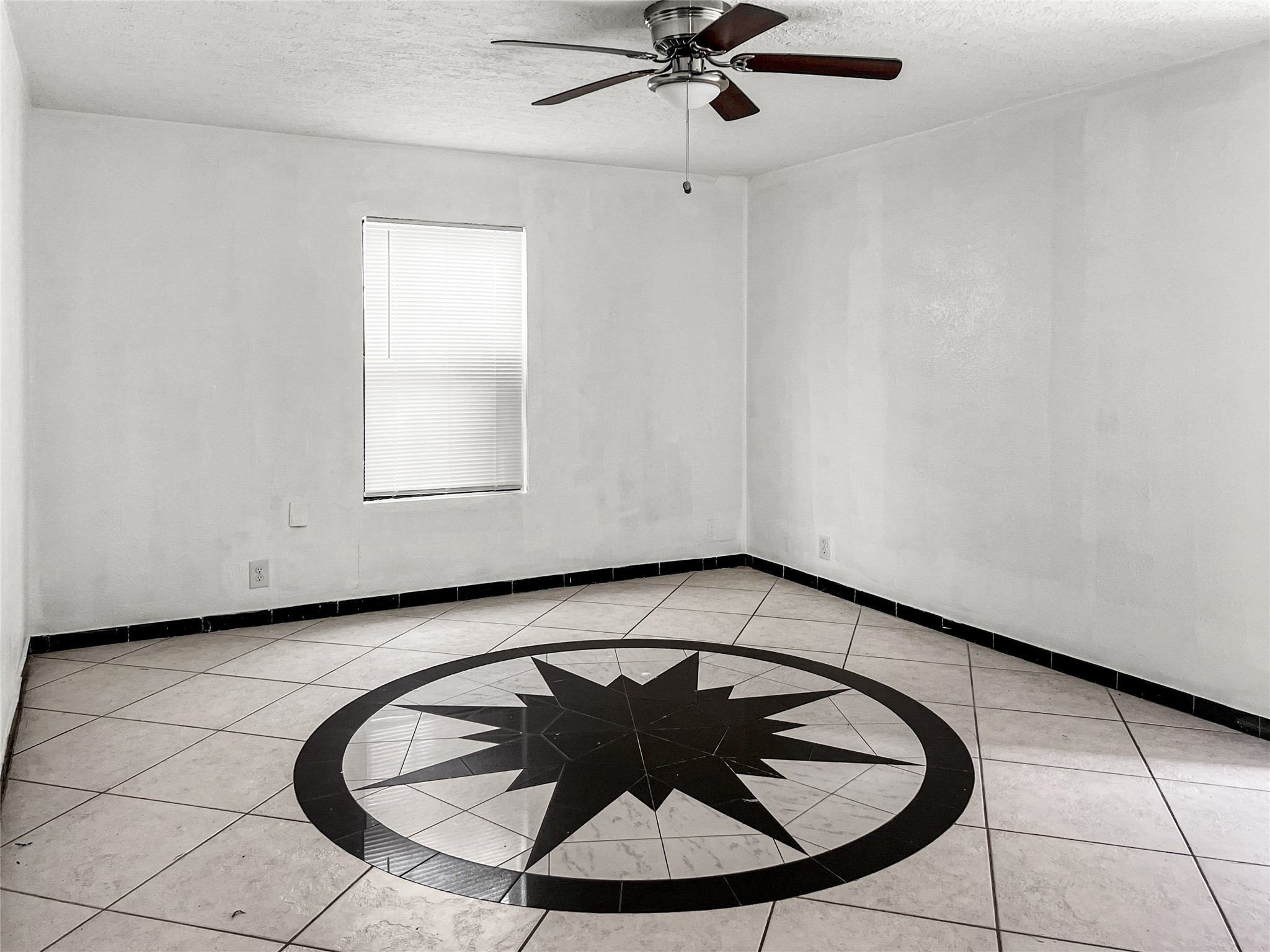 4803 Robertson Street Houston, TX 77009 - Photo 2 of 4 a view of a room with a sink and a window