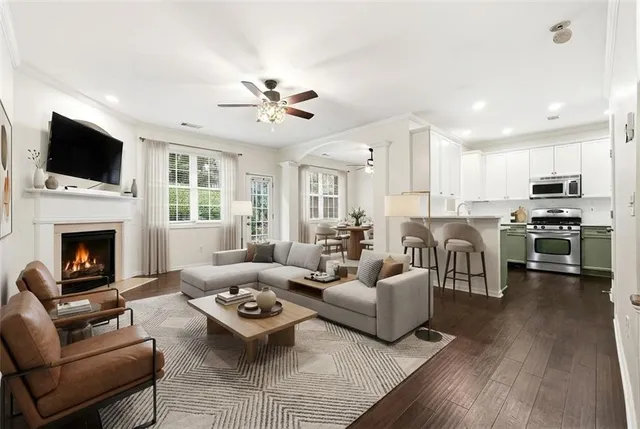 a living room with furniture fireplace and flat screen tv