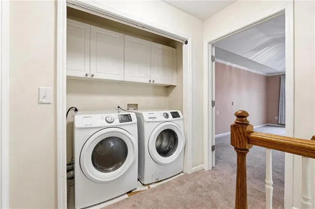a view of hallway with washer and dryer