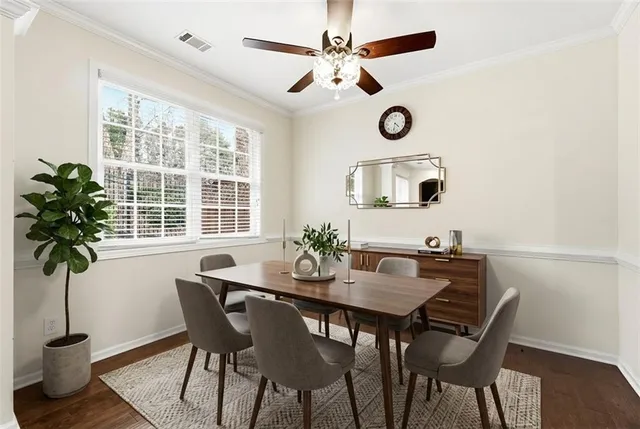 a view of a dining room with furniture and window