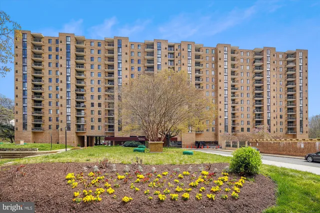 a view of a building with a yard