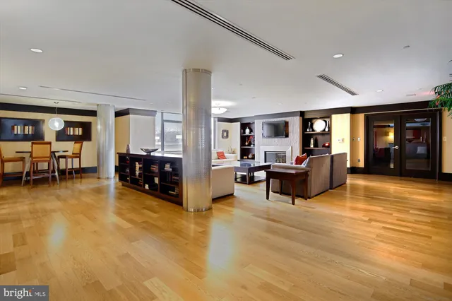 a view of a dining room with furniture and a chandelier