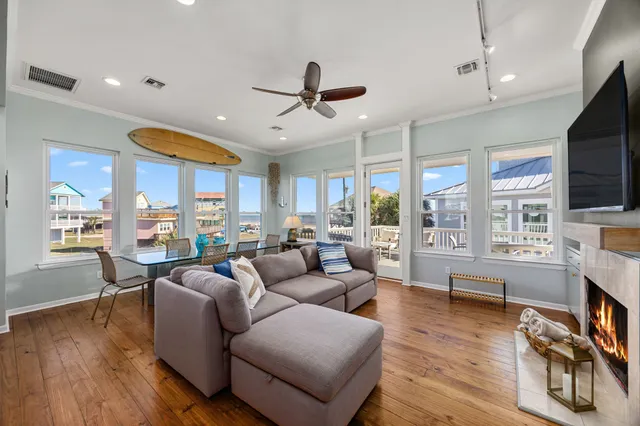 a living room with fireplace furniture and a flat screen tv
