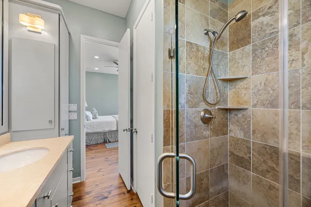 a bathroom with a shower and a sink