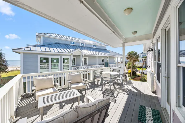 a view of a patio with couches table and chairs