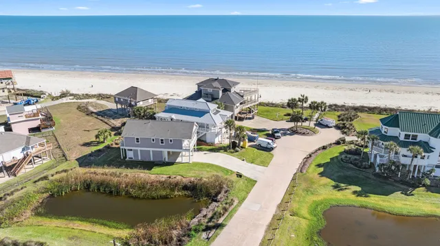 a view of a swimming pool with a yard