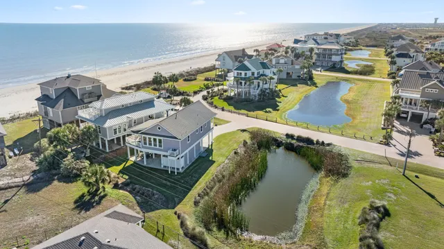 a view of a house with outdoor space and a lake view