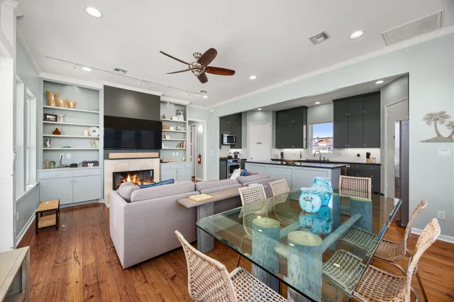 a living room with fireplace furniture and a flat screen tv