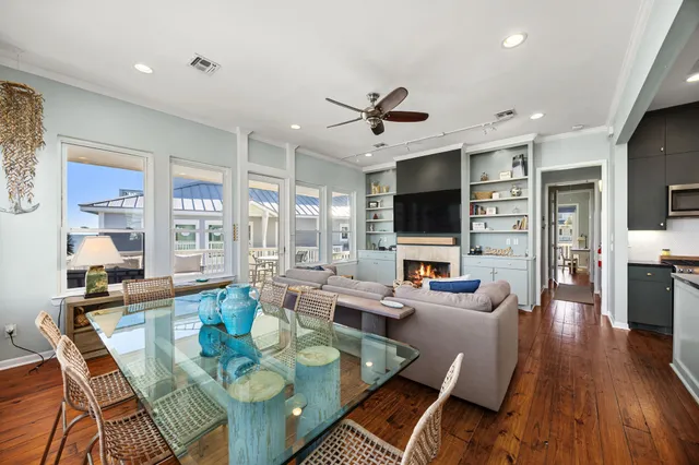 a living room with fireplace furniture and a flat screen tv