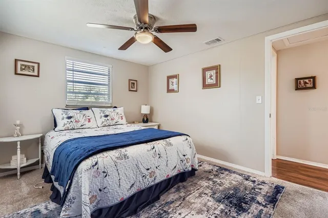 a bedroom with bed and a window