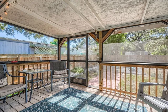 a view of a chairs and table in the balcony