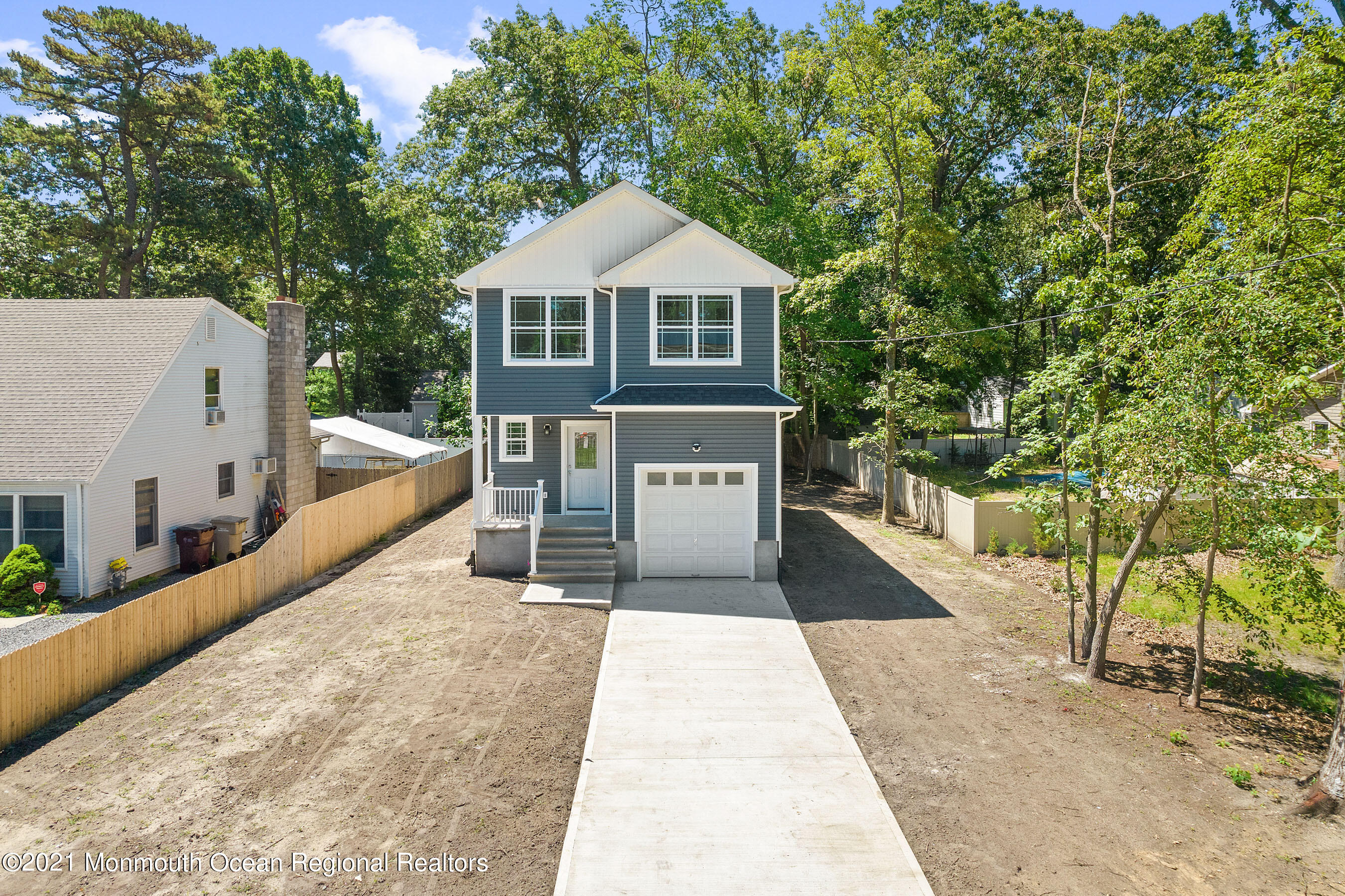 308 Riverside Drive Bayville, NJ 08721 - Photo 1 of 35 a front view of a house with a yard