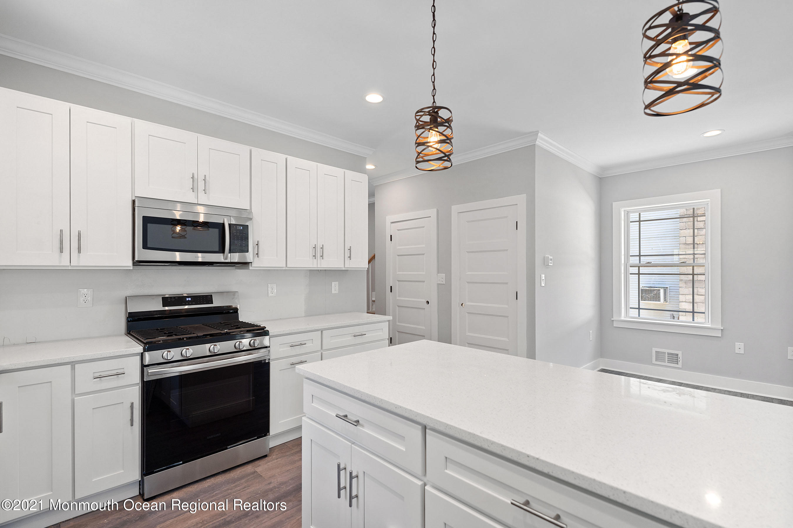 308 Riverside Drive Bayville, NJ 08721 - Photo 13 of 35 a kitchen with a sink a stove and microwave