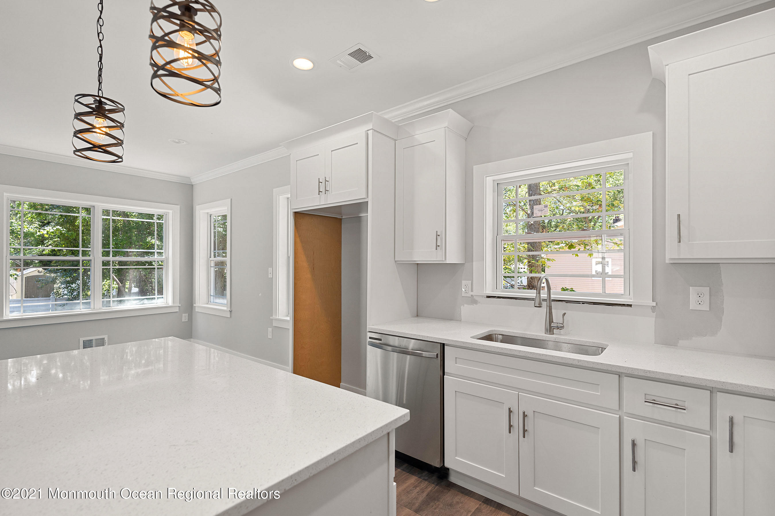 308 Riverside Drive Bayville, NJ 08721 - Photo 14 of 35 a kitchen with a sink a window and cabinets