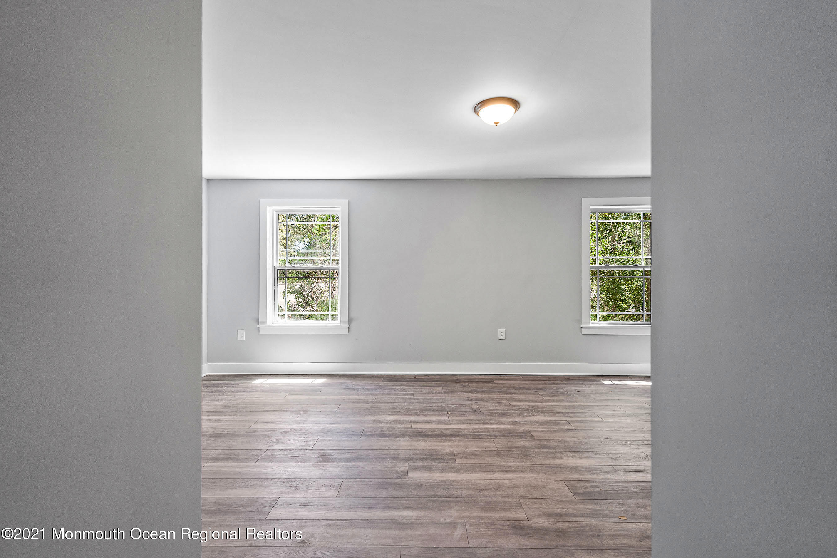 308 Riverside Drive Bayville, NJ 08721 - Photo 23 of 35 a view of room with window and wooden floor