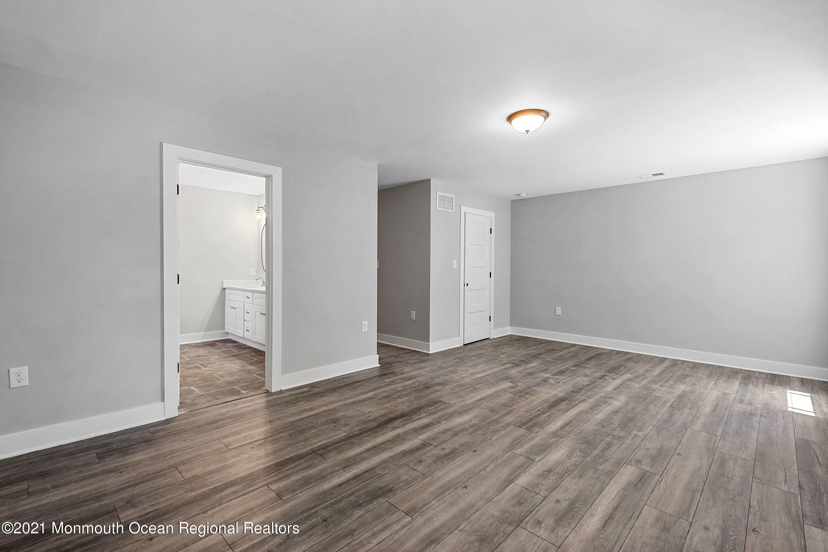 308 Riverside Drive Bayville, NJ 08721 - Photo 25 of 35 a view of empty room with wooden floor