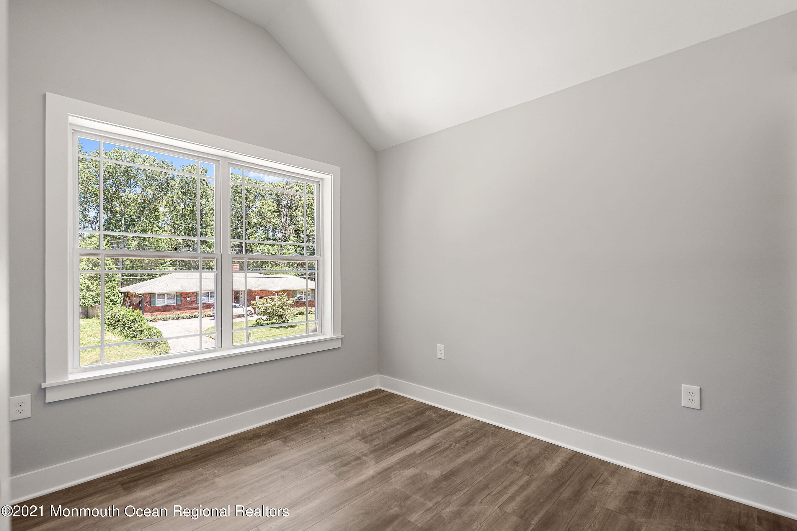 308 Riverside Drive Bayville, NJ 08721 - Photo 27 of 35 a view of an empty room with wooden floor and a window