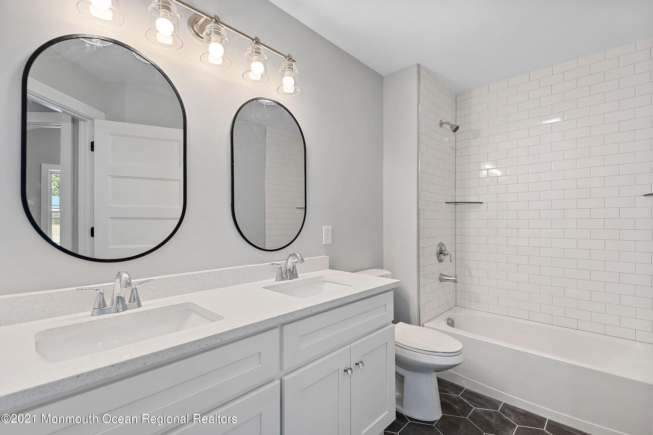308 Riverside Drive Bayville, NJ 08721 - Photo 32 of 35 a bathroom with a double vanity sink mirror and toilet