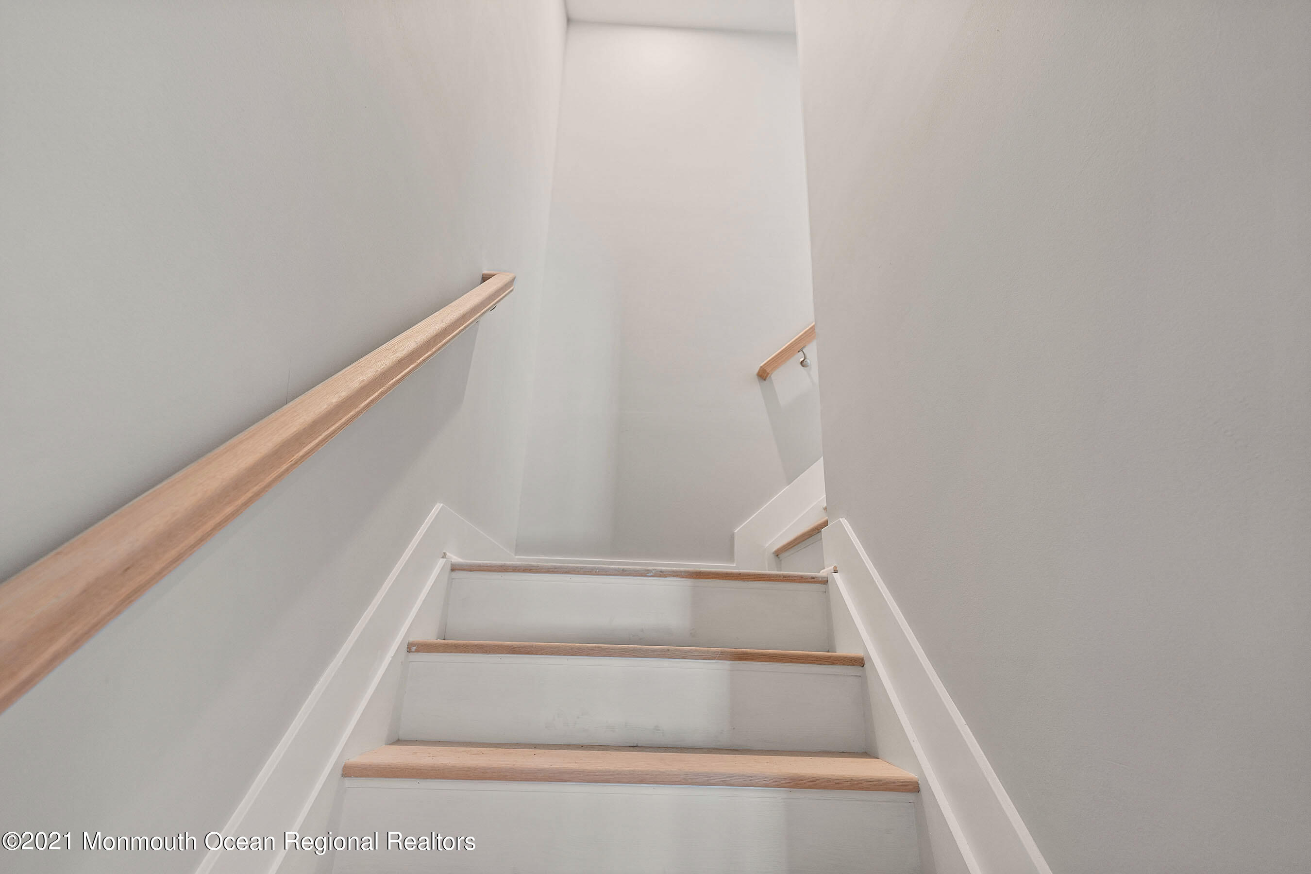 308 Riverside Drive Bayville, NJ 08721 - Photo 33 of 35 a view of staircase with white walls and white door