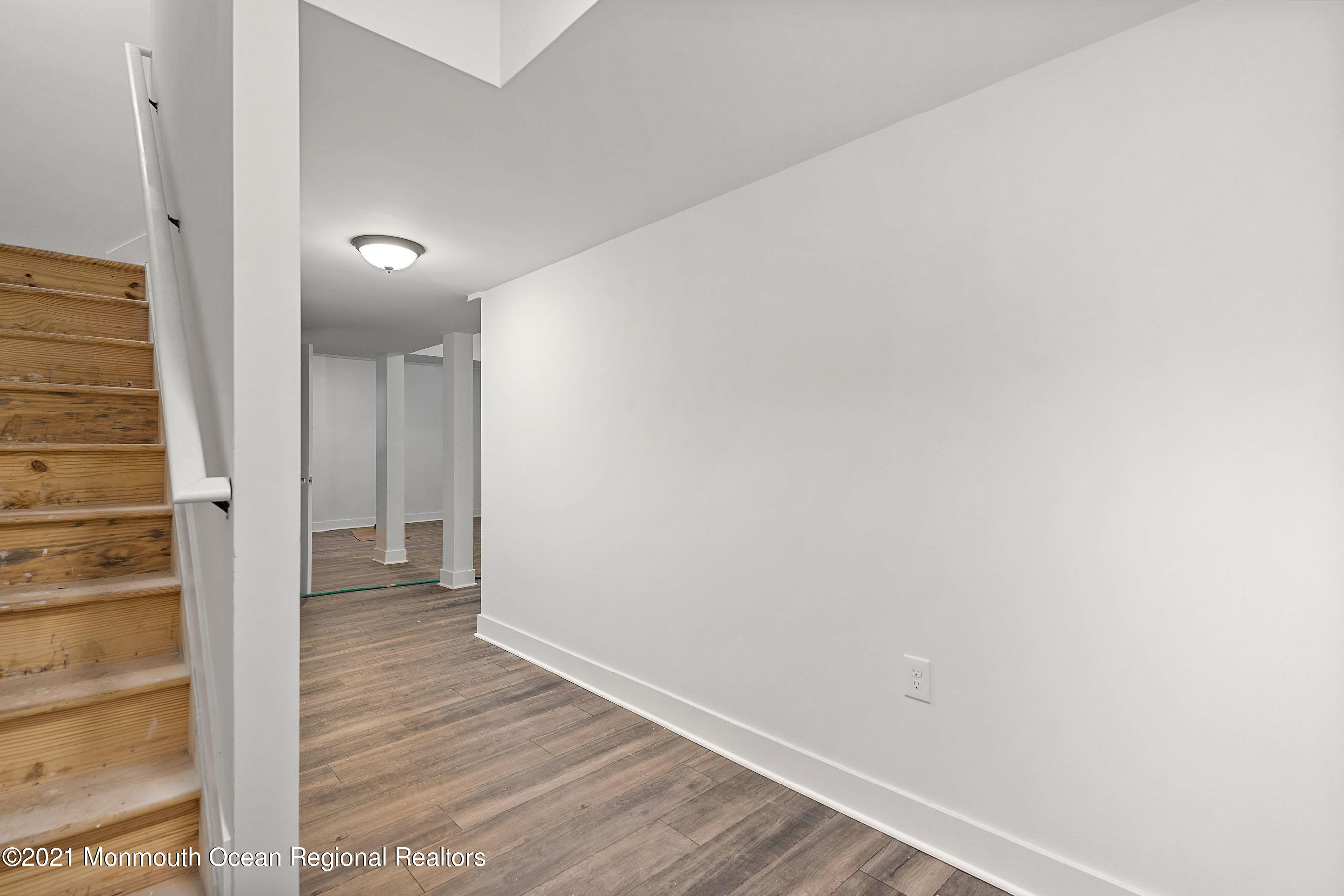308 Riverside Drive Bayville, NJ 08721 - Photo 34 of 35 a view of a hallway with wooden floor