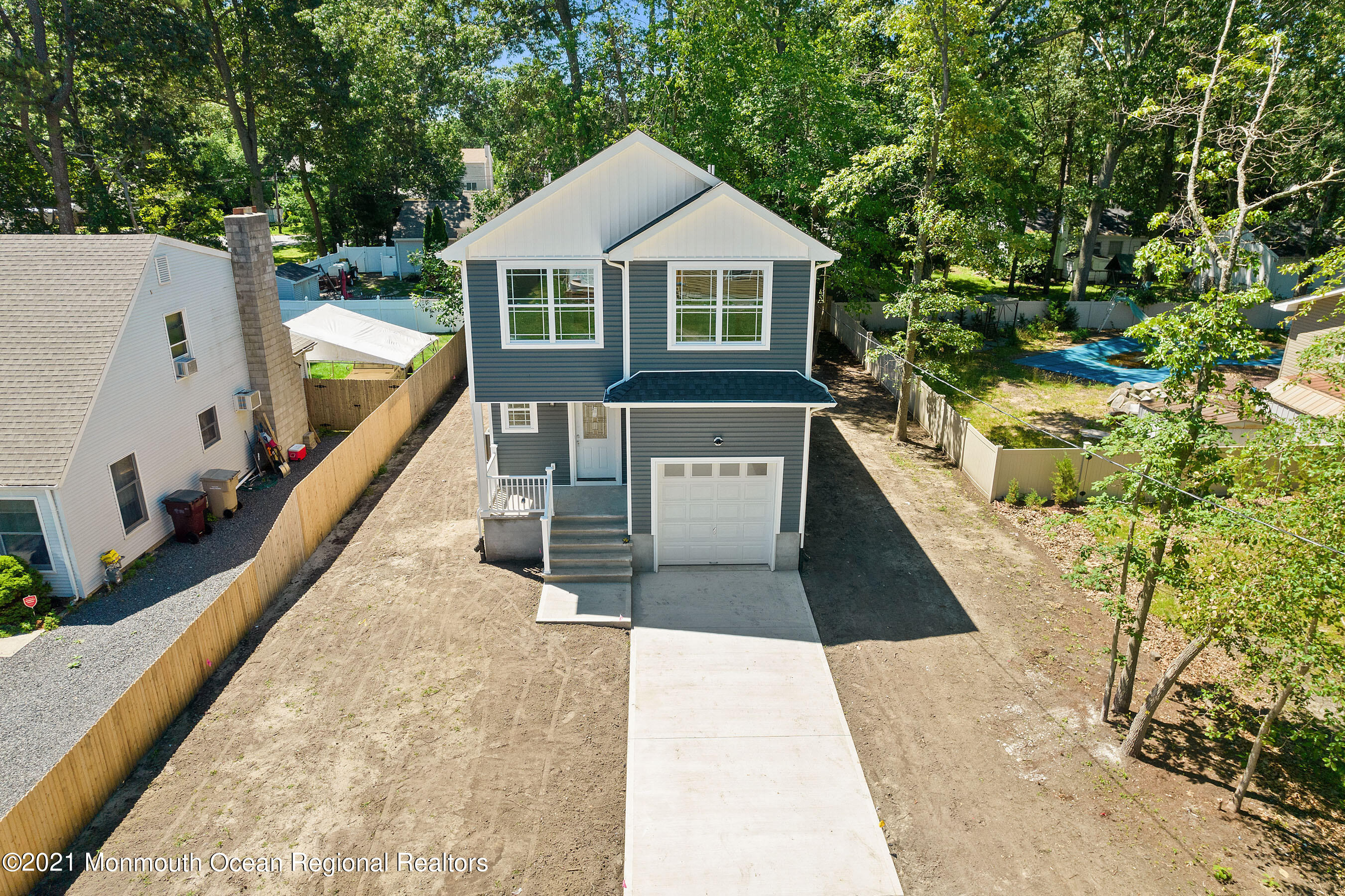 308 Riverside Drive Bayville, NJ 08721 - Photo 5 of 35 a house with trees in the background