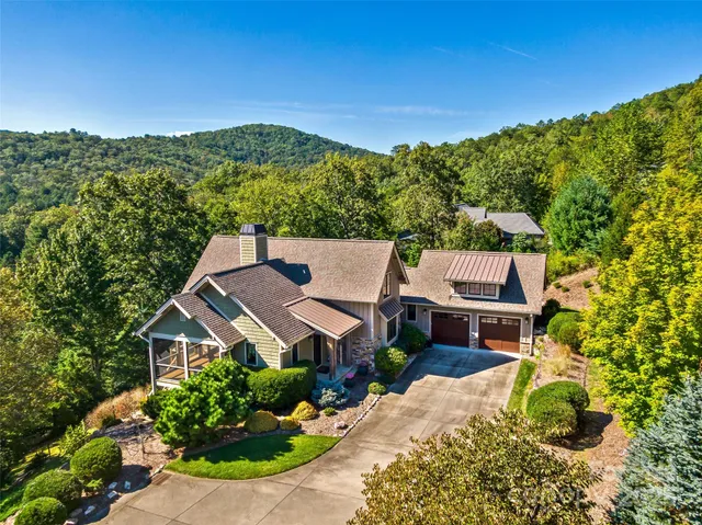an aerial view of a house with a garden