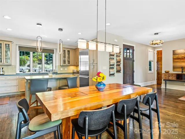 a view of a dining room with furniture and window