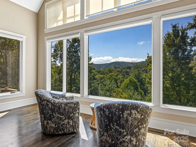 a view of a living room filled with furniture