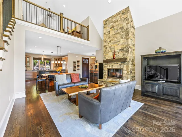 a living room with fireplace furniture and a flat screen tv