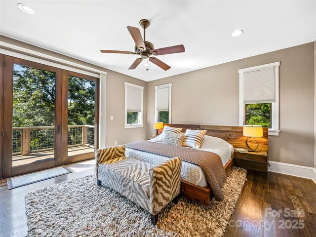 a bedroom with a large bed and a large window