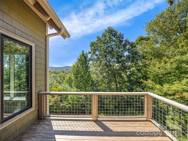 a view of a balcony with wooden floor