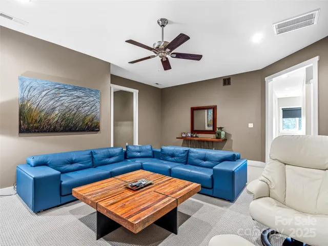a living room with furniture and a rug