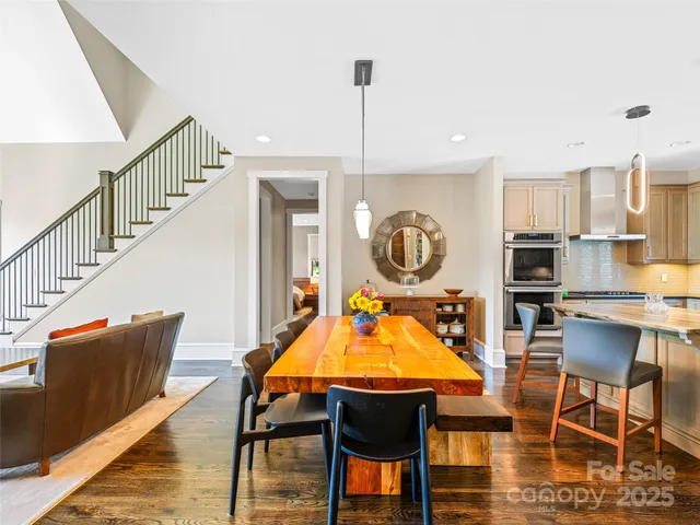 a living room with furniture a rug and a chandelier