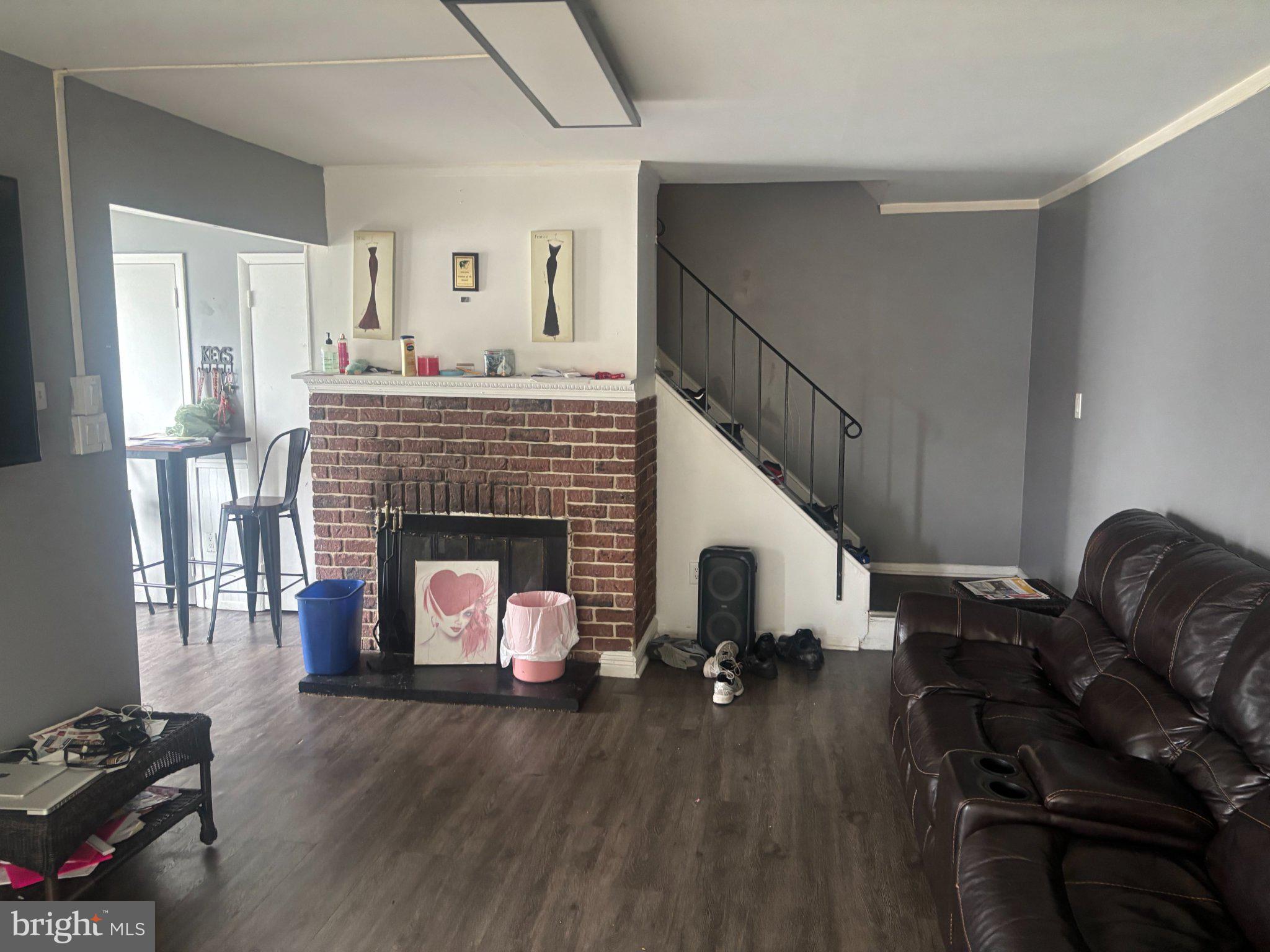 5 Locust Court Sicklerville, NJ 08081 - Photo 2 of 8 a living room with furniture and a fireplace