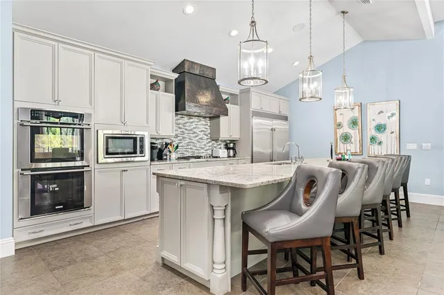 a bathroom with a granite countertop sink a toilet a mirror a vanity and shower