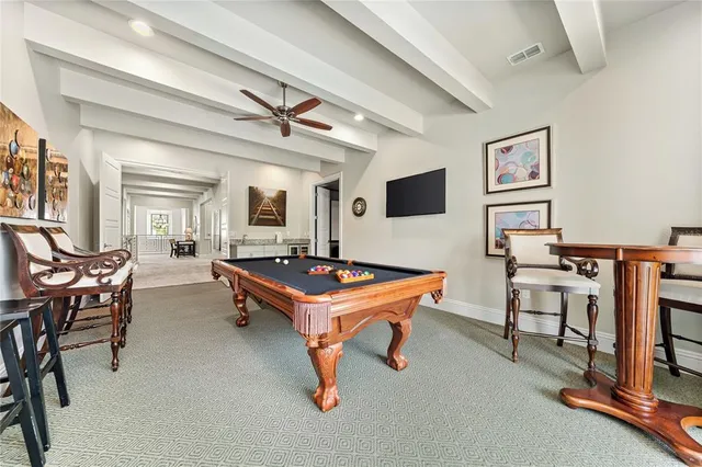 a view of a backyard with a garden and entertaining space