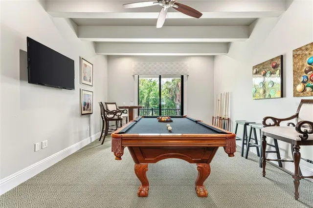 a bedroom with a large bed and a flat screen tv