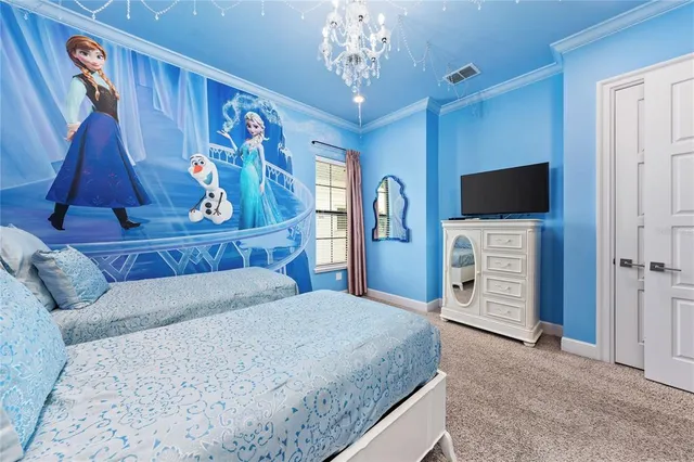 a spacious bedroom with a bed and a large window