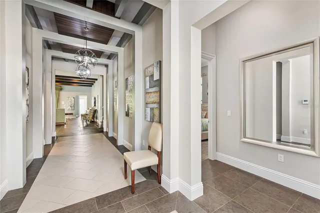 a room with furniture pool table and windows