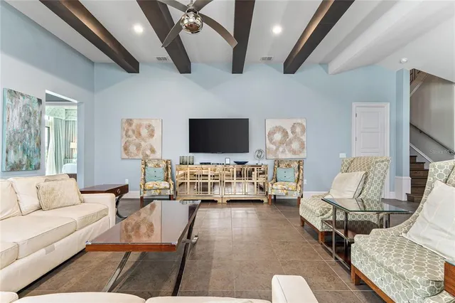 a bed room with a bed and a flat tv screen on dresser